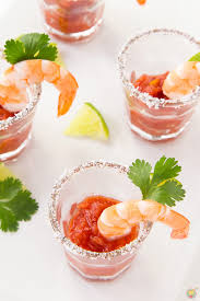 To serve put the cocktail sauce in a medium bowl and surround with the shrimp, or loop the shrimp over the edge of an individual cocktail glass and top with the sauce. Shrimp Cocktail Shooters Cooking On The Front Burner