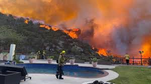 Los Angeles fires, wind cancel high ...