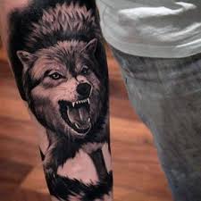 Black And Grey Realism Wolf Tattoo 50 Realistic Wolf Tattoo Designs For Men Canine Ink Ideas Tattoo Designs Men Wolf Tattoo Design Wolf Tattoos Men