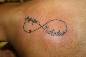 A red infinity sign outlined with black ink with names written between, this will be a good one for those who wants to write a name. Pin By Kelly Orandello On Loves Tattoos With Kids Names Infinity Tattoo Tattoos For Kids
