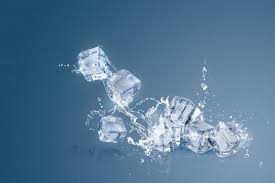 Ice Cubes Isolated Over A Blue And Copy Space