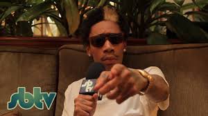 Wiz khalifa tattooed the word faith on the bottom of his neck.along with a tattoo of a star with wings. Wiz Khalifa Tattoos Sbtv Youtube