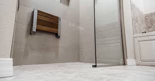 Black hexagonal floor tile runs continuously through the space. Converting A Tub To A Zero Threshold Shower Aipcontractor Com