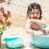 Taking bath in tub ; 1
