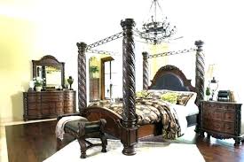 Includes poster bed with canopy (upholstered headboard, footboard, posts, canopy and rails), nightstand, chest of drawers and dresser with mirror. Ashley Furniture Ashley Furniture North Shore Bedroom Set