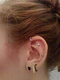 Pin By Michele Marquez On Tattoos Ear Cuff Piercing Outer Conch Piercing White Tassel Earrings