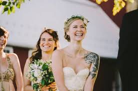 22 Beautiful Brides Who Showed Off Their Tattoos With Pride Tattoo Wedding Dress Brides With Tattoos Wedding Tattoos