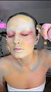 i love this makeup technique! the red eyeshadow was too vibrant for this  makeup, so i decided to balance the color by spattering watered down white  body paint then i tapped the paint out some to blend ...