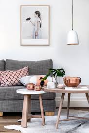 On this table display created by interior designer gabriella khalil, books, decorative boxes, and other simple objects are on the lower shelf with only a few more decorative items on the top level. Modern Living Room Modern Coffee Table Decor Novocom Top