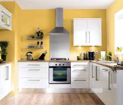These cabinets were placed against golden yellow walls and light cherry wood floors, creating a really warm atmosphere in the kitchen. 50 Yellow Kitchen Ideas Photos Home Stratosphere