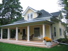 This stunning covered front porch is built with low maintenance vinyl products from the gray azek decking, white columns, and railings to the white beadboard ceilings and wood beams wrapped in pvc. Porches Decks Plekkenpol Builders Inc Bloomington Mn