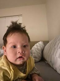 Any ideas for baby's unusual sleeping position?