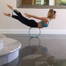 Salabhasana On Wheel Yoga Dharma Yoga Basic Yoga Poses Wheel Pose Yoga