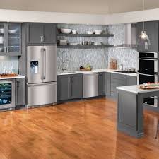 Contemporary Slate Grey Cabinets With Stainless Appliances Warm Hardwood Floors And Unique Glass Tile Modern Grey Kitchen Grey Kitchen Cabinets Kitchen Design