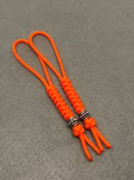 If you don't have this hole you can drill into your knife or wrap the cord around the bottom of your knife. 95 Paracord Micro Knife Lanyard 2pk Orange Cord Snake Knot Etsy