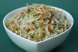Use a knife to cut the red cabbage and green cabbage into thin strips. How To Make Nigerian Coleslaw Cook With Kemi