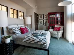 Red accents on pillows, in bedspread and on lampshades. Neutral Bedroom With Mixed Patterns And Red Accents Hgtv