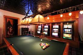 Pool Table And Slot Machines In A Basement Game Room Game Room Basement Games Bonus Rooms