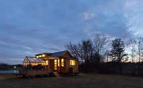 There are 13 pages in this free plan that includes drawings, photos, diagrams, and instructions on how to build it. Unique Tiny Home With Attached Greenhouse Deck And Pergola Off Grid World