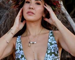 Kauai Cone Shells Encasing a Tahitian Pearl in Your Choice of Material