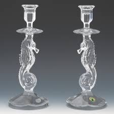 With a realistic carved style, the weathered whitewash resin candleholders resemble seahorses with blue mosaic glass accents. A Pair Of Waterford Crystal Seahorse Candlesticks 09 19 13 Sold 115