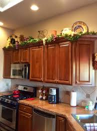 Decorating Above The Kitchen Cabinets Tuscandecor Decorating Above Kitchen Cabinets Above Kitchen Cabinets Tuscan Decorating Kitchen