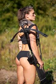 Half-naked Female Hunter In Top And Camouflage Waiting For Opportunities To  Shoot Using Weapon Or Rifle, Hunting Concept. Side View Stock Photo,  Picture And Royalty Free Image. Image 159093324.