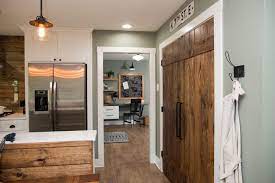 We prefer the natural wood to paint. Natural Wood Kitchen Pantry Doors Framed With White Molding In Seafoam Green Wall Hgtv