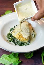 Baking This Delicious Dish Sealed In Foil Along With Garlic Cream Spinach Adds Additional Flavor While It Steams The Fis Seafood Recipes Seafood Dinner Recipes