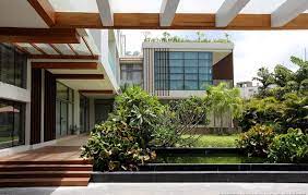 They created these homes to fit. Big L Shaped House With A View Spine Architects Myanmar