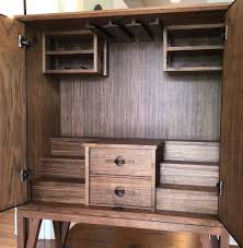 Watch the second part of me making a liquor cabinet with hidden, lifting storage real quick. Walnut Liquor Cabinet Keith Johnson Custom Woodworking