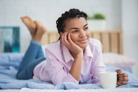 Free Photo | Relaxed african woman drinking tea in bed