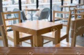 Adding a coffee table to your home unit is a great way to add a touch of class. Table And Chair In Food Court Cafe Coffee Shop Cafeteria Restaurant Interior With Wood Table For Montage Or Display Your Product Stock Photo Picture And Royalty Free Image Image 78161087