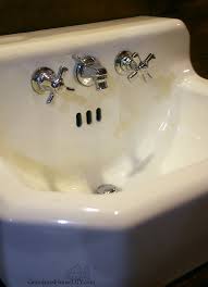 Abrasive scrubbers can scratch the surface. How To Clean And Remove Stains From An Old Cast Iron Sink