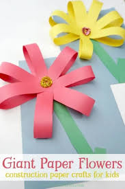 These paper flowers are really easy to make. Giant Paper Flowers Construction Paper Crafts For Kids Twitchetts