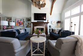 Large and simple living space featuring a pair of modern sofa sets with two center tables set on the hardwood flooring. Simple Large Living Room Ideas Novocom Top