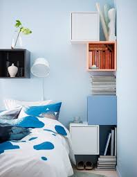 A Diy Bedside Table Setup Made From Colourful Cubic Cabinets Secured To The Walls Around A Bed Ikea Bedroom Storage Ikea Small Bedroom Eket