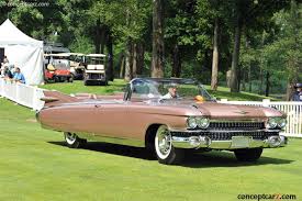 This is a fully restored pink body with a full white convertible hood. 1959 Cadillac Eldorado Biarritz Convertible
