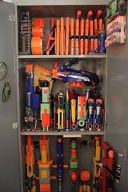 Бластер hasbro nerf дино рекс рэмпейдж. Huge Nerf Gun Collection Custom Built Storage Cabinet 800 00 Picclick