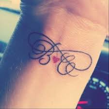 Men love to have kids name tattoos on their body. Husband Wife Tattoo Ideas Picture Tattoos Tattoos Infinity Tattoos