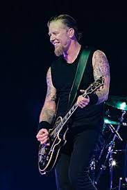 James hetfield in a frame with his wife and children. James Hetfield Wikipedia