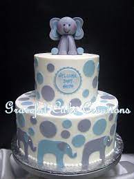 Elephant Themed Baby Shower Cake With A Fondant Elephant Topper And Blue And Gray Polka Dots Elephant Baby Shower Cake Baby Shower Cakes For Boys Trendy Baby Shower Ideas