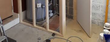 If you're building a stud wall in a garage or basement, you'll use metal tracks to attach the studs to. Stud Wall To Reduce Noise From Garage Boiler Adhochandyman York