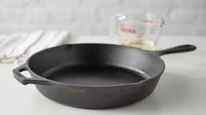 Apply a thin layer of oil. Guide To Seasoning A Cast Iron Skillet Tablespoon Com