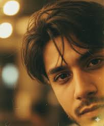 Create A raw close-up portrait of a young man, use my uploaded photo a...