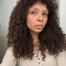 Who specializes in curly cuts near Radcliff?