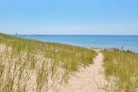 Find that perfect souvenir at one of the smaller shops, or reinvent your entire artistic aesthetic at your new favorite gallery. 24 Hours In Muskegon State Park Lake Michigan Sunset Beach Dunes Lighthouse Camping Michigan Travel Blog Flashpacking America