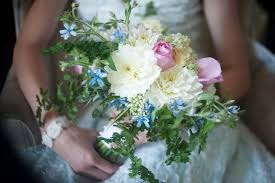 We love how this gardenia boutonniere by lake murray flower shoppe shared by the knot looks against the groom's classic suit. Wedding Flowers Blue Wedding Flowers October
