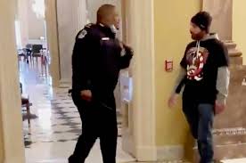 Hero capitol police officer eugene goodman escorts kamala harris at inauguration. Coz5kwkycqeirm