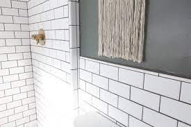 One of the best tools for subway tile or any tile for that matter is a laser level. Our Modern Subway Tile Bathroom Bright Green Door